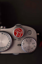 Load image into Gallery viewer, Silver Red Fuji Soft Release Button - Hyperion Handmade Camera Straps
